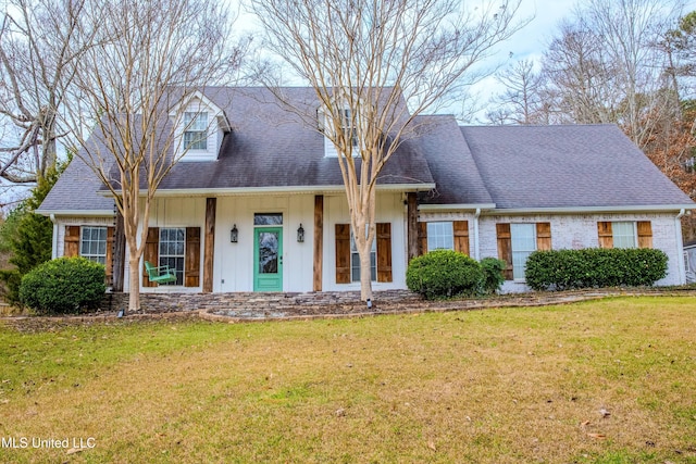 cape cod-style house with a front lawn