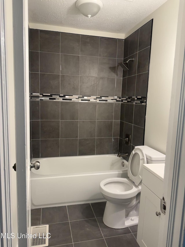 661 Robinhood Rd, Jackson, MS 39206 - full bathroom with tile patterned flooring, vanity, toilet, shower / bathtub combination, and a textured ceiling