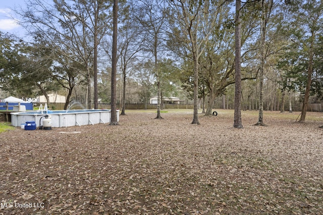 view of yard featuring an outdoor pool