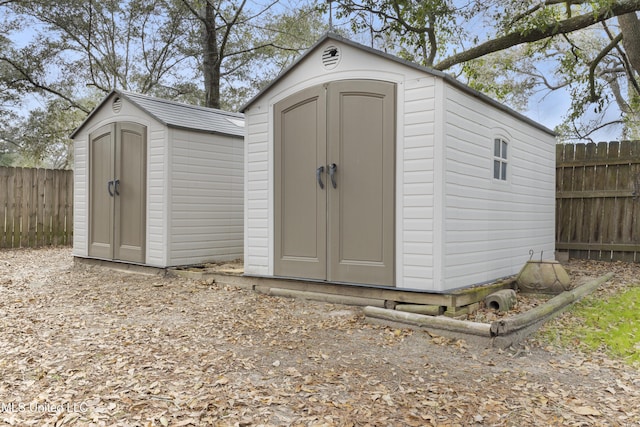 view of shed featuring a fenced backyard