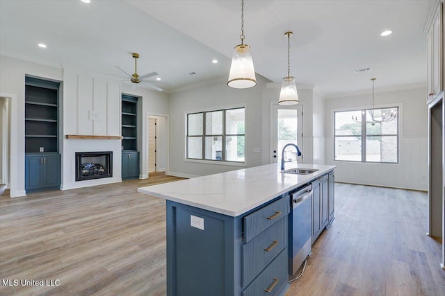 104 Brents Xing, Clinton, MS 39056 - kitchen featuring a sink, dishwasher, ceiling fan, crown molding, and blue cabinetry