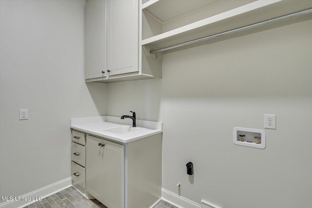 104 Brents Xing, Clinton, MS 39056 - washroom with hookup for a washing machine, cabinet space, baseboards, and hookup for a gas dryer