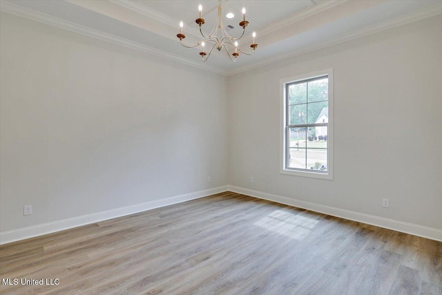 104 Brents Xing, Clinton, MS 39056 - unfurnished room featuring a chandelier, wood finished floors, a tray ceiling, ornamental molding, and baseboards