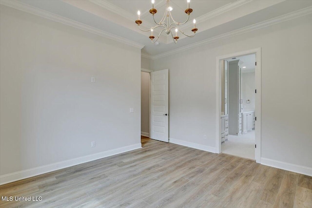 104 Brents Xing, Clinton, MS 39056 - empty room featuring a chandelier, light wood finished floors, crown molding, and baseboards
