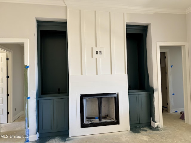 interior details with a fireplace and crown molding