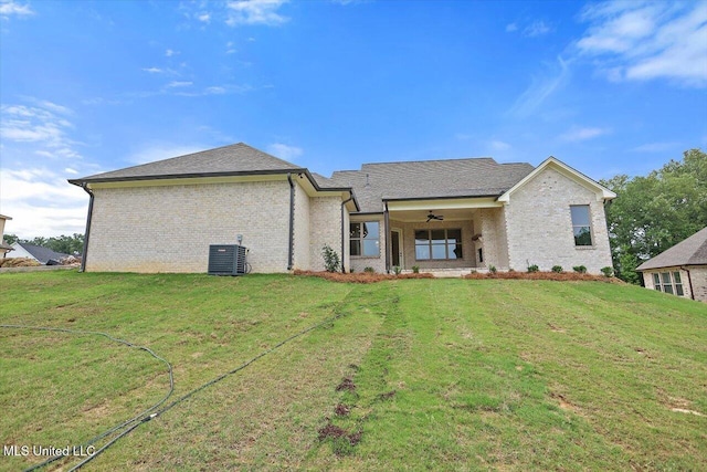 104 Brents Xing, Clinton, MS 39056 - rear view of property featuring central AC unit, a yard, ceiling fan, and brick siding
