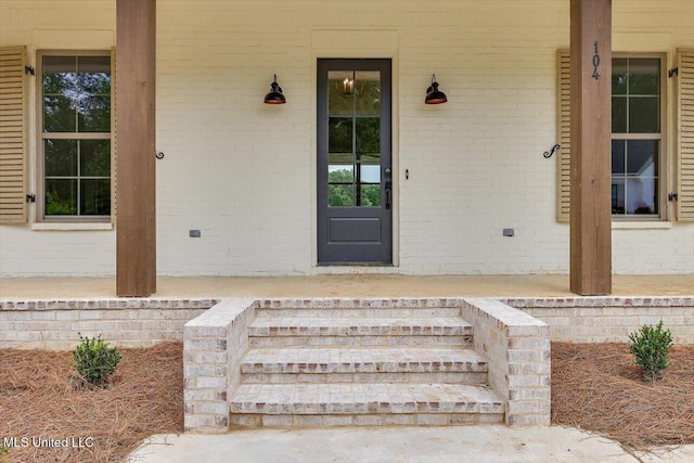 104 Brents Xing, Clinton, MS 39056 - property entrance with covered porch and brick siding