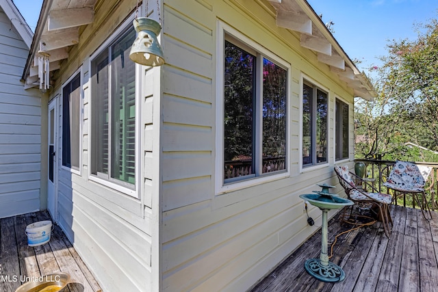 view of property exterior featuring a deck