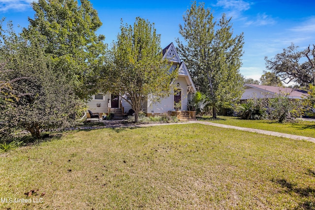 obstructed view of property featuring a front yard