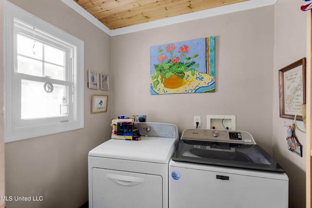 clothes washing area with independent washer and dryer and wood ceiling