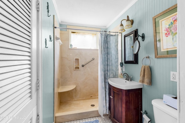 bathroom featuring vanity, ornamental molding, toilet, and walk in shower