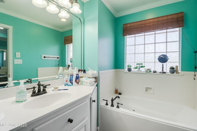 13061 Jordan Pl, Gulfport, MS 39503 - bathroom featuring a tub with jets, vanity, crown molding, and healthy amount of natural light
