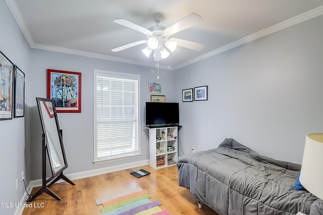 13061 Jordan Pl, Gulfport, MS 39503 - bedroom with wood finished floors, ornamental molding, baseboards, multiple windows, and ceiling fan
