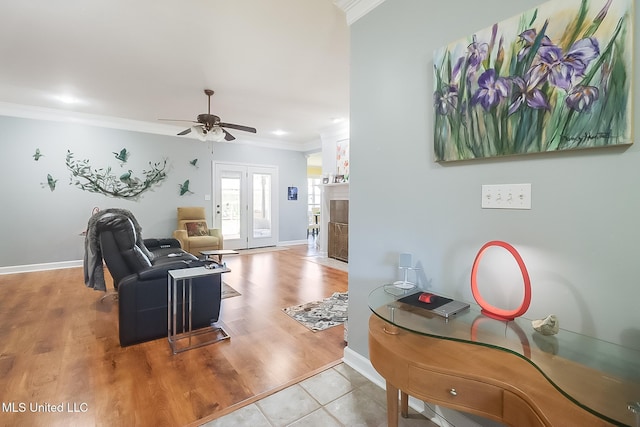 13061 Jordan Pl, Gulfport, MS 39503 - living room with ornamental molding, a ceiling fan, a fireplace, baseboards, and wood finished floors