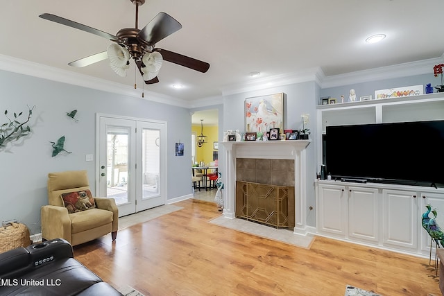 13061 Jordan Pl, Gulfport, MS 39503 - living room with crown molding, light wood-style floors, ceiling fan, recessed lighting, and baseboards