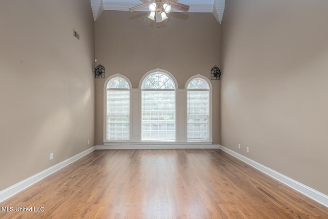 8679 Saddle Creek Dr, Olive Branch, MS 38654 - unfurnished room with ceiling fan, high vaulted ceiling, wood finished floors, and ornamental molding