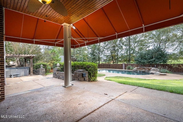 8679 Saddle Creek Dr, Olive Branch, MS 38654 - fenced backyard with a hot tub, a ceiling fan, a patio area, and a pergola
