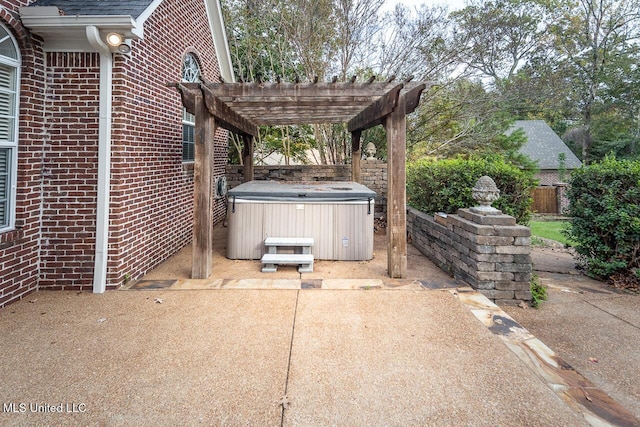 8679 Saddle Creek Dr, Olive Branch, MS 38654 - view of patio / terrace with a hot tub and a pergola
