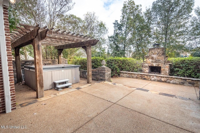 8679 Saddle Creek Dr, Olive Branch, MS 38654 - view of patio / terrace featuring a hot tub, an outdoor stone fireplace, and a pergola