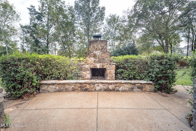 8679 Saddle Creek Dr, Olive Branch, MS 38654 - view of patio with an outdoor stone fireplace