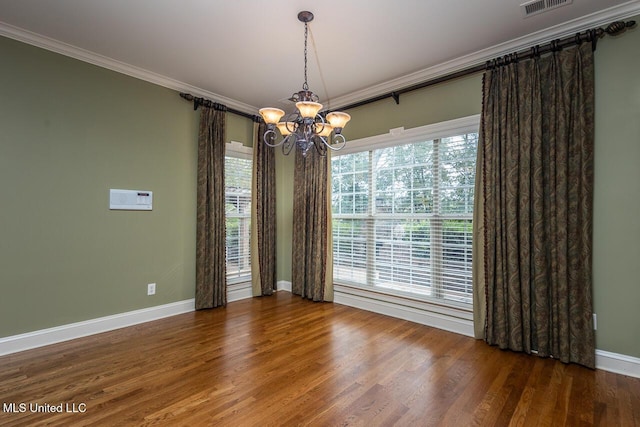 8679 Saddle Creek Dr, Olive Branch, MS 38654 - spare room featuring crown molding, a chandelier, and wood finished floors