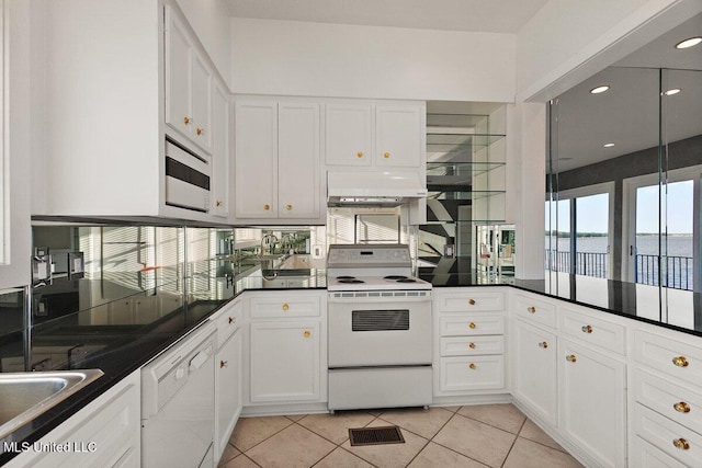 21 Breakers Ln, Ridgeland, MS 39157 - kitchen featuring white appliances, under cabinet range hood, a water view, white cabinetry, and recessed lighting