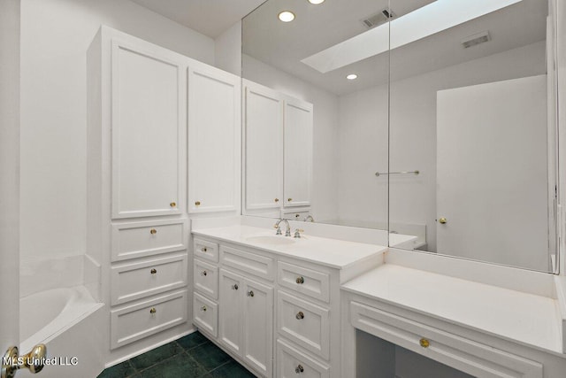 21 Breakers Ln, Ridgeland, MS 39157 - full bathroom with recessed lighting, vanity, a skylight, tile patterned flooring, and a bath