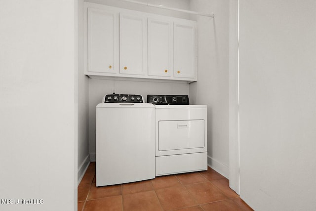 21 Breakers Ln, Ridgeland, MS 39157 - laundry area with washer and dryer, tile patterned floors, cabinet space, and baseboards