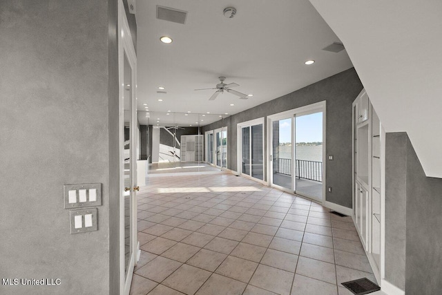 21 Breakers Ln, Ridgeland, MS 39157 - hallway with recessed lighting, light tile patterned floors, and a textured wall