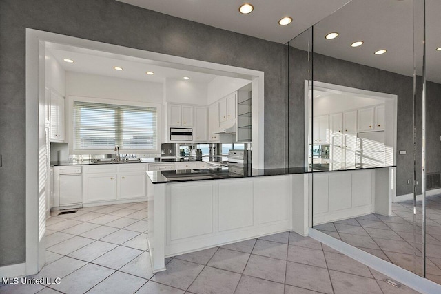 21 Breakers Ln, Ridgeland, MS 39157 - kitchen with under cabinet range hood, white cabinetry, recessed lighting, electric range oven, and a sink