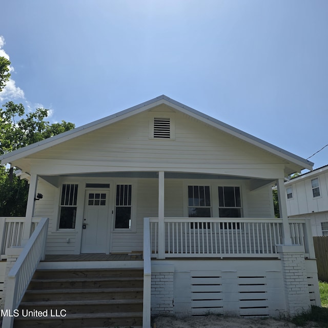 246 Bohn St, Biloxi, MS 39530 - bungalow-style home featuring a porch