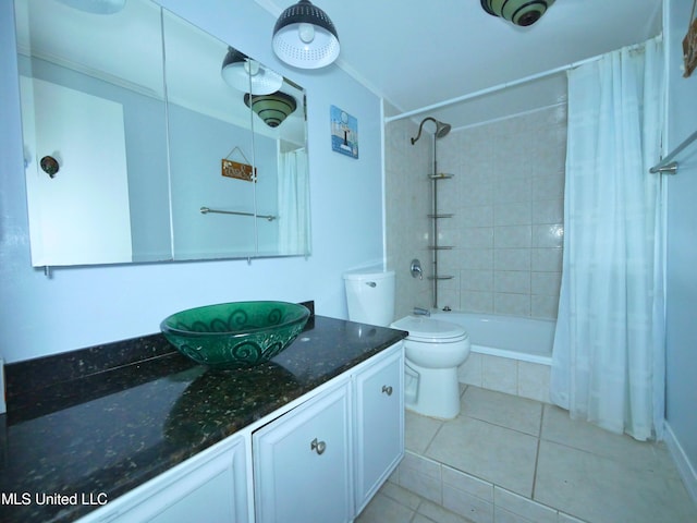 full bathroom featuring tile patterned flooring, vanity, toilet, and shower / tub combo