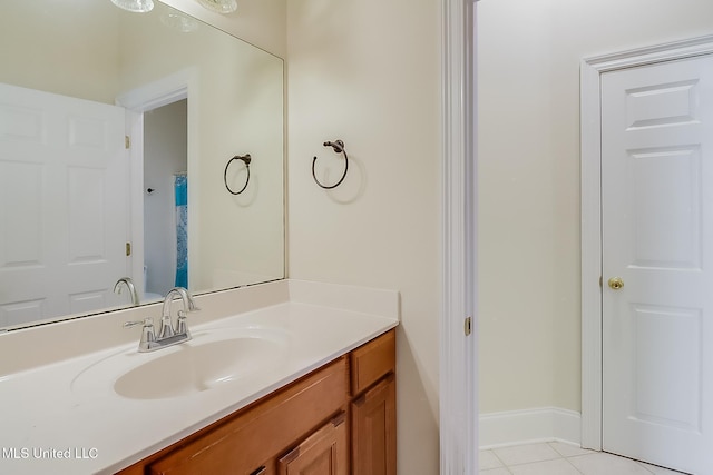 bathroom featuring tile patterned flooring and vanity