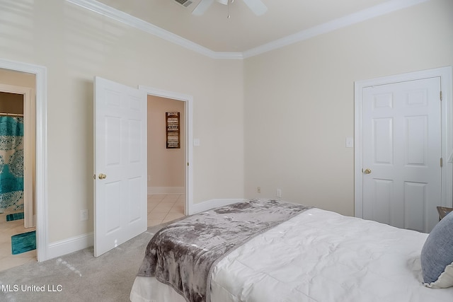 carpeted bedroom with ornamental molding, ceiling fan, and baseboards