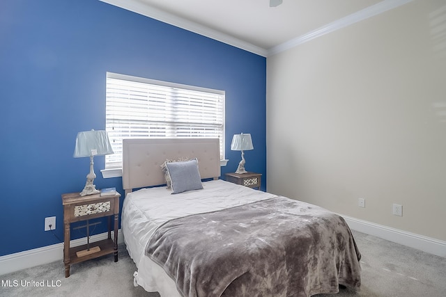 bedroom with baseboards, carpet floors, and crown molding