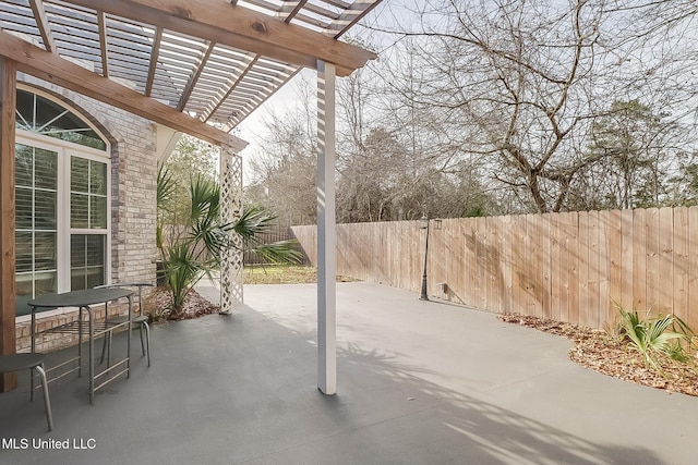 view of patio / terrace featuring fence and a pergola