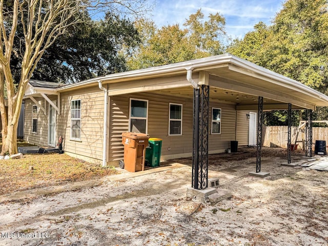 exterior space featuring a carport