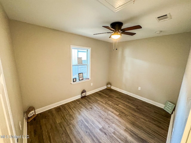 unfurnished room featuring ceiling fan and dark hardwood / wood-style flooring