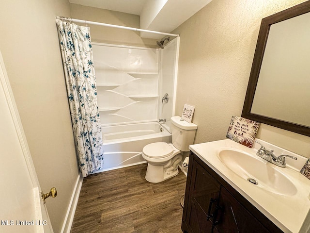 full bathroom with shower / bath combo, hardwood / wood-style floors, vanity, and toilet