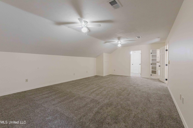 bonus room featuring carpet, baseboards, visible vents, ceiling fan, and vaulted ceiling