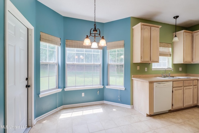 16383 Clearwater Cir, Gulfport, MS 39503 - kitchen with white dishwasher, light brown cabinetry, a chandelier, and healthy amount of natural light