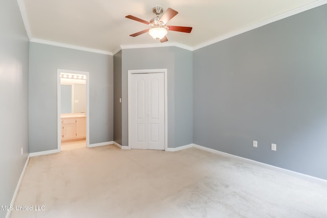 16383 Clearwater Cir, Gulfport, MS 39503 - unfurnished bedroom with ornamental molding, light colored carpet, ensuite bathroom, a ceiling fan, and a closet