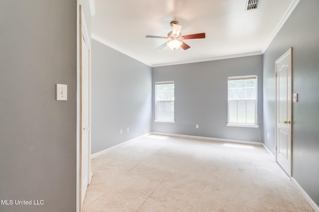 16383 Clearwater Cir, Gulfport, MS 39503 - spare room with a ceiling fan, carpet, crown molding, and healthy amount of natural light