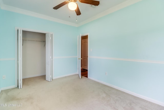16383 Clearwater Cir, Gulfport, MS 39503 - unfurnished bedroom with ornamental molding, carpet, a closet, and a ceiling fan