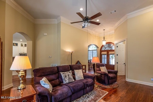 living room featuring ceiling fan, french doors, crown molding, and dark wood-type flooring