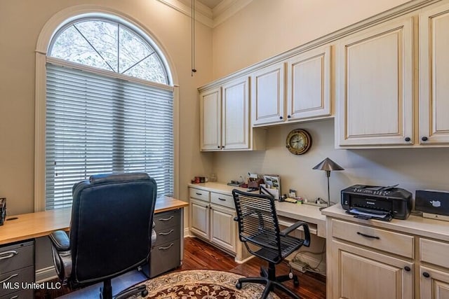 home office with ornamental molding and dark wood-type flooring