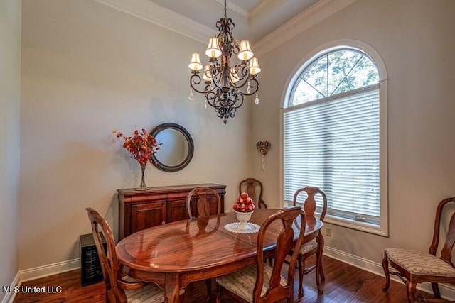 dining area featuring a chandelier, dark hardwood / wood-style flooring, and ornamental molding