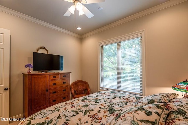 bedroom featuring ceiling fan and crown molding