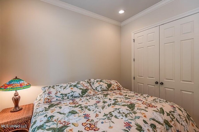 bedroom with a closet and ornamental molding