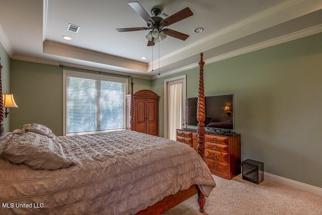 bedroom featuring carpet, a raised ceiling, ceiling fan, and ornamental molding